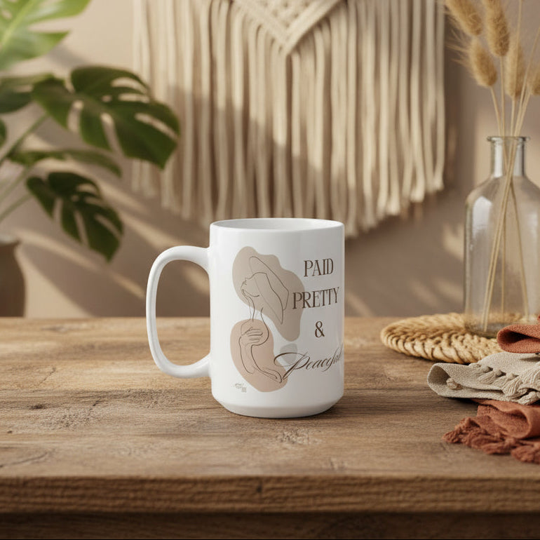 White mug with artistic illustrations and text on a white background